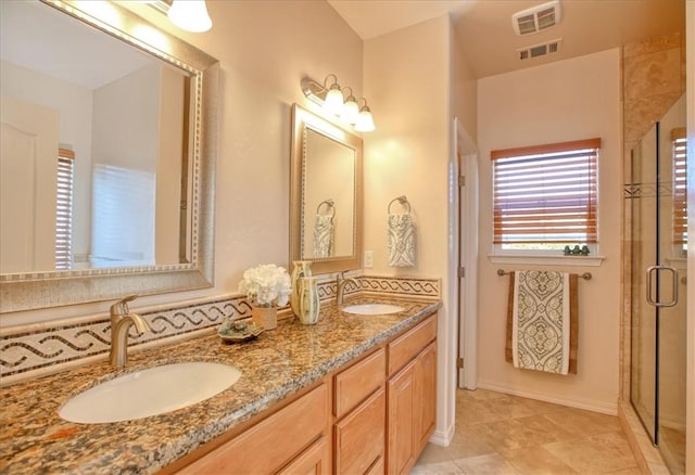 bathroom featuring vanity, a wealth of natural light, and an enclosed shower