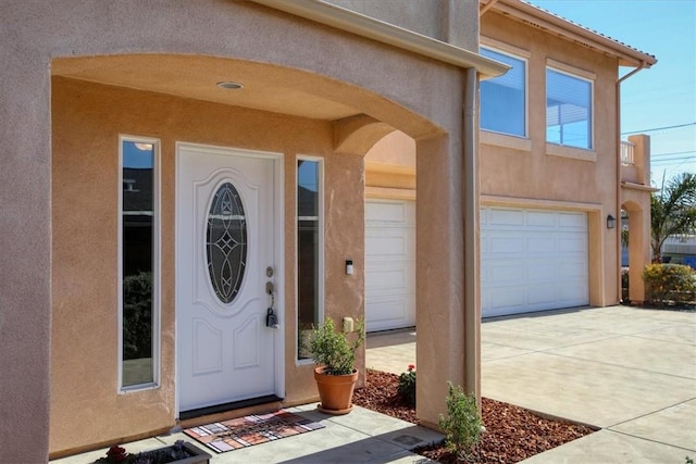 doorway to property featuring a garage