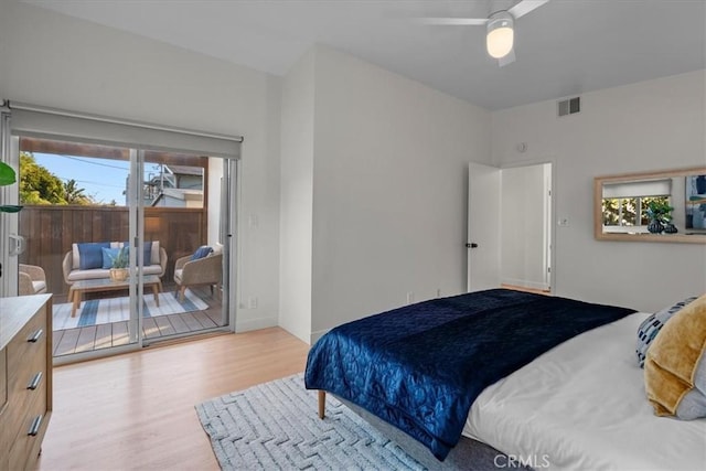 bedroom with multiple windows, access to outside, ceiling fan, and light hardwood / wood-style flooring