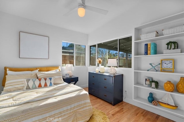 bedroom featuring ceiling fan and light hardwood / wood-style flooring