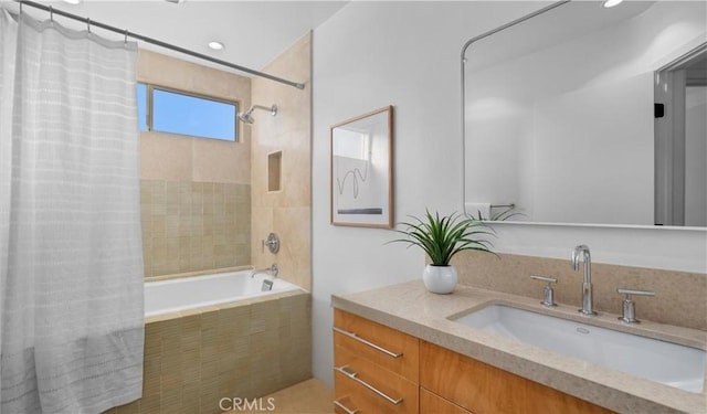 bathroom featuring vanity and shower / bath combo