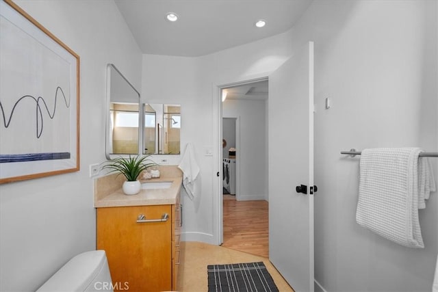 bathroom with vanity and toilet