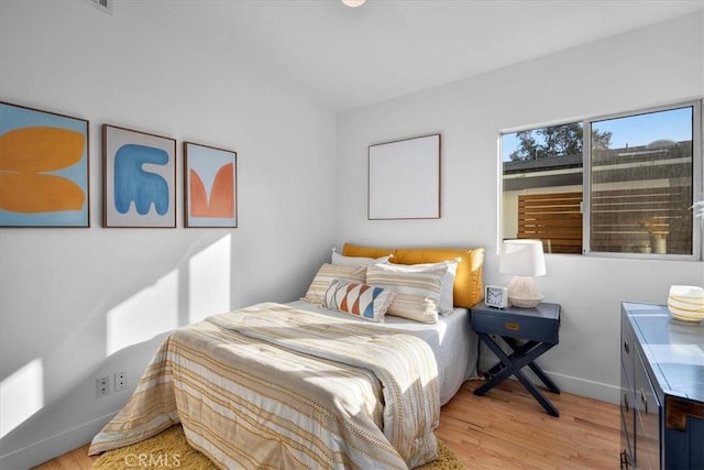 bedroom featuring light hardwood / wood-style floors