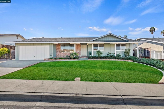 ranch-style home with a garage and a front lawn