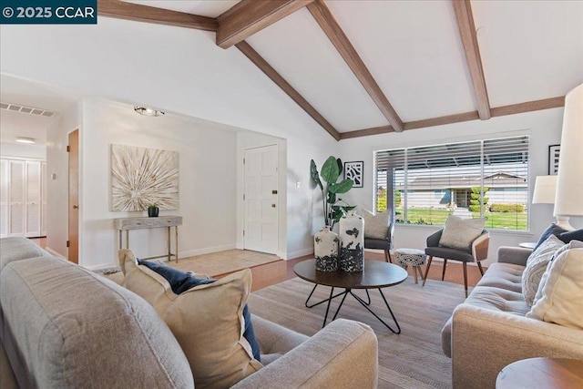 living room featuring high vaulted ceiling and beamed ceiling