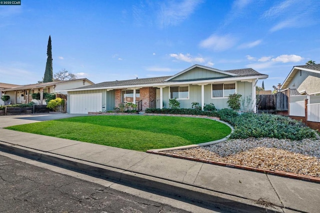 single story home featuring a garage and a front yard