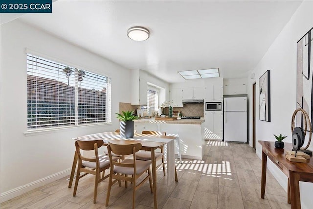 dining area featuring light hardwood / wood-style flooring