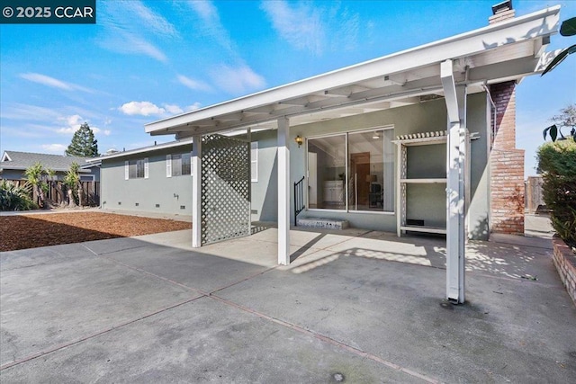 rear view of property with a patio