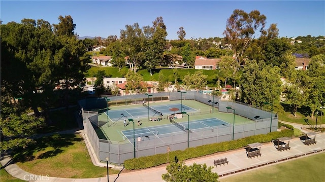 view of sport court with fence