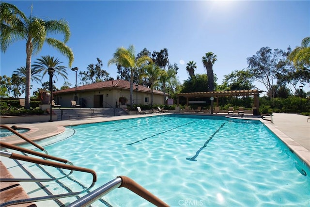 view of pool with a patio area and a pergola