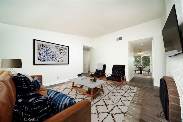 living room featuring dark wood-type flooring