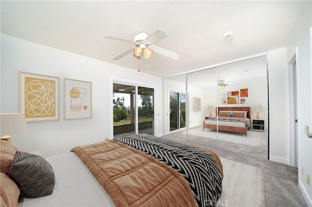 bedroom featuring baseboards, a ceiling fan, access to outside, carpet floors, and a closet