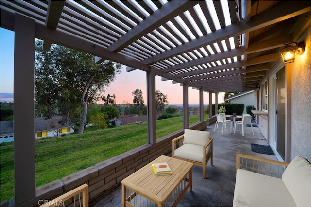 patio terrace at dusk with a yard and a pergola