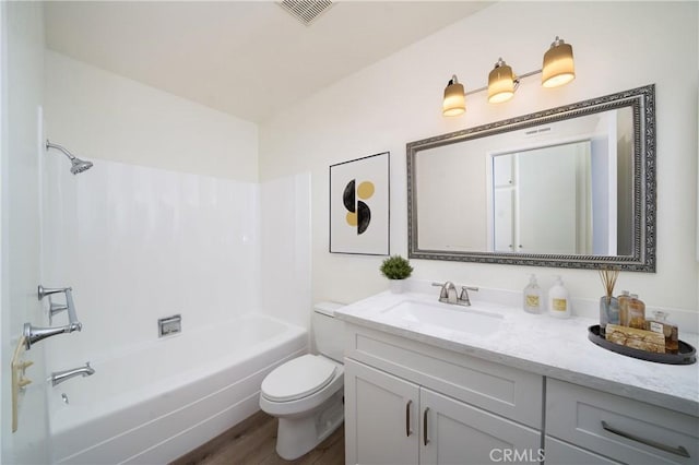 full bath featuring visible vents, toilet, shower / tub combination, wood finished floors, and vanity