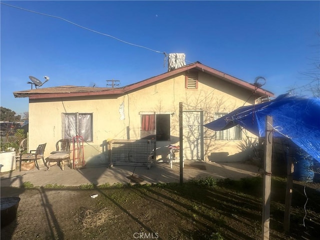 rear view of property with a patio