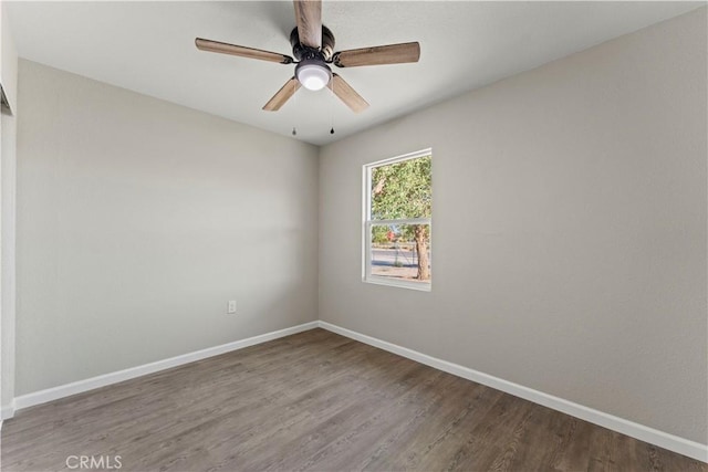 spare room featuring hardwood / wood-style flooring and ceiling fan