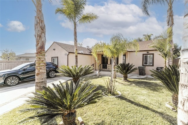 view of front of home with a front lawn