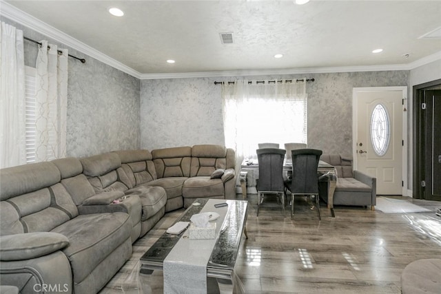 living room featuring crown molding and wood-type flooring