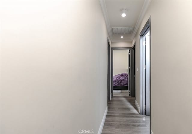 corridor with ornamental molding and dark hardwood / wood-style floors