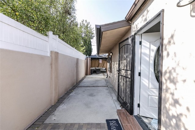 view of side of property with a patio area