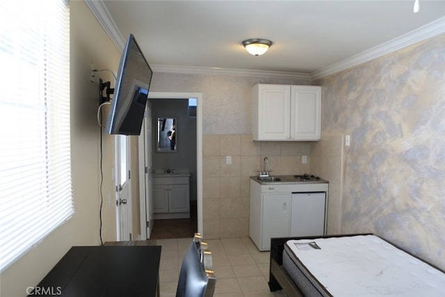 kitchen featuring white cabinetry, light tile patterned floors, crown molding, and tile walls