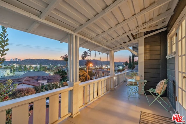 view of balcony at dusk