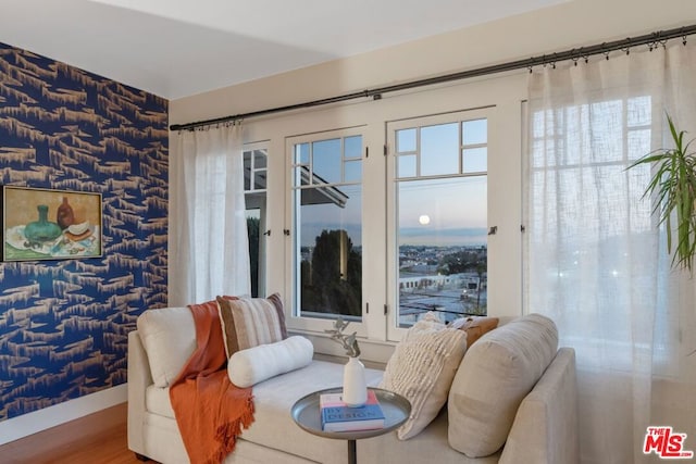 living area with hardwood / wood-style floors