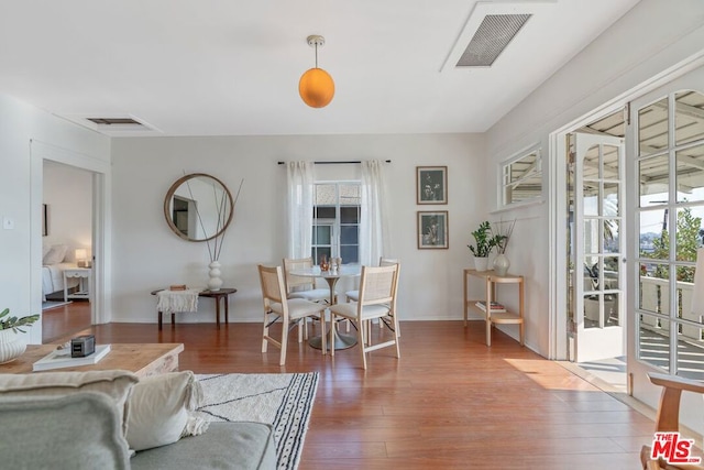 dining space featuring dark hardwood / wood-style flooring