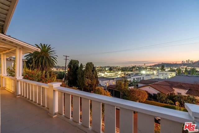 view of balcony at dusk