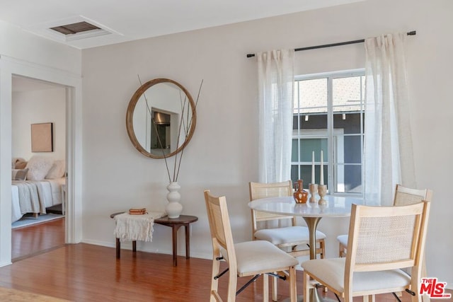 dining area featuring dark hardwood / wood-style floors