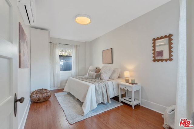 bedroom featuring light hardwood / wood-style floors