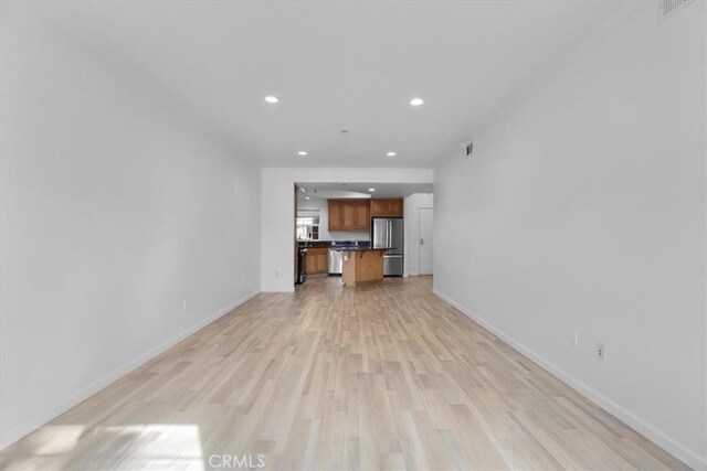 unfurnished living room featuring light wood-type flooring