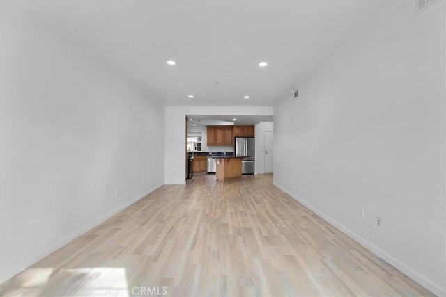 unfurnished living room with light hardwood / wood-style flooring