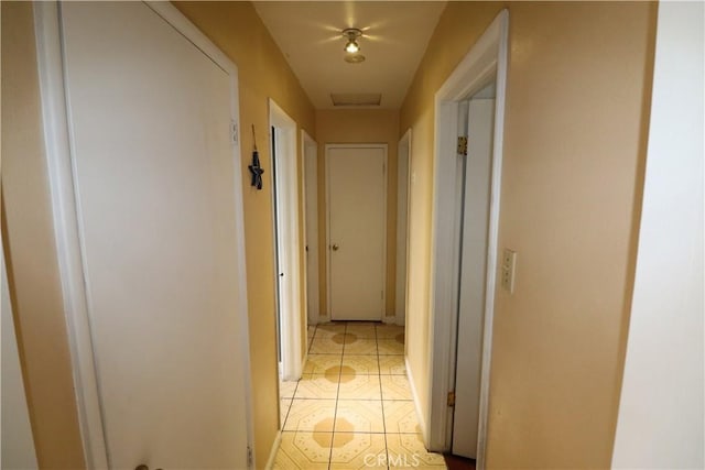 hallway with light tile patterned flooring