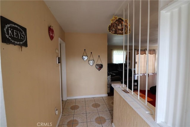 hallway featuring light tile patterned flooring