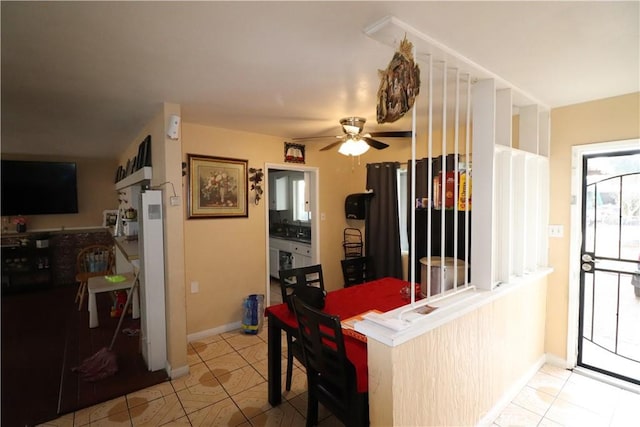 kitchen featuring light tile patterned flooring and ceiling fan