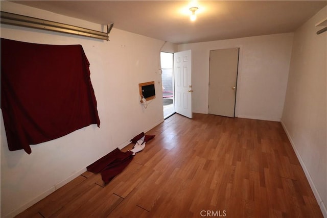 spare room featuring light hardwood / wood-style floors