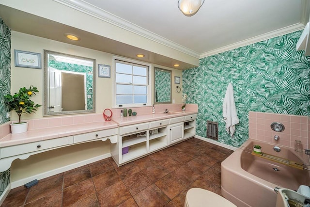 bathroom with vanity, a bath, ornamental molding, and toilet