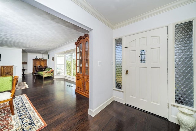 foyer entrance featuring dark hardwood / wood-style flooring and ornamental molding