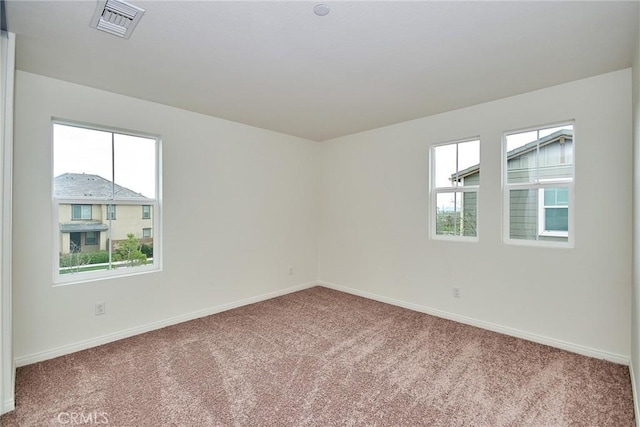 spare room with carpet floors