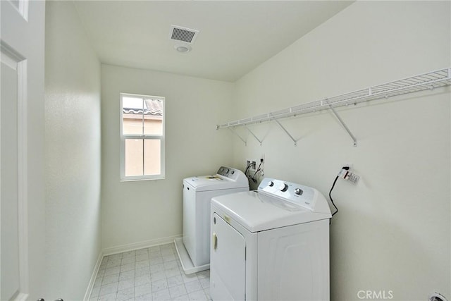 laundry room with separate washer and dryer