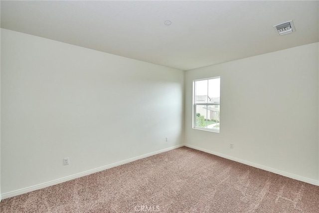 empty room with carpet flooring