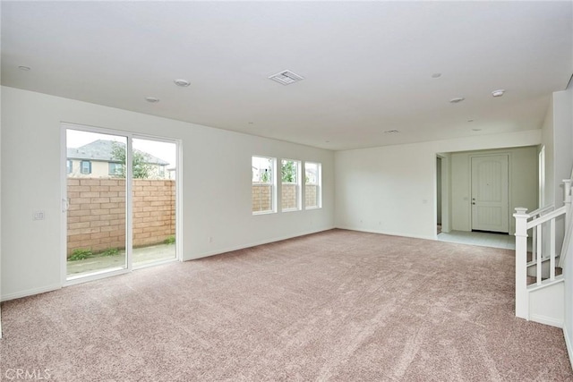 empty room featuring light carpet