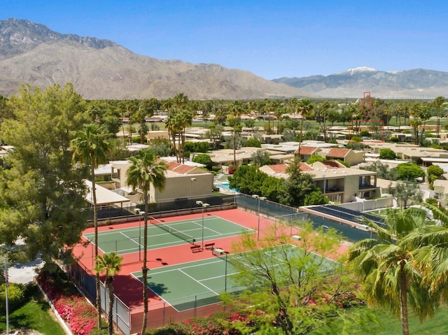 birds eye view of property with a mountain view