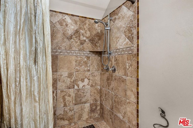 bathroom with a shower with curtain