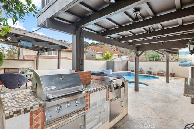 view of patio / terrace featuring a fenced in pool, area for grilling, and grilling area