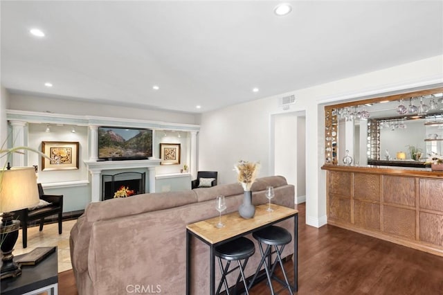 living room with dark hardwood / wood-style flooring