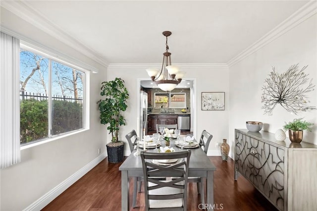 dining area featuring crown molding, dark hardwood / wood-style flooring, a chandelier, and a wealth of natural light