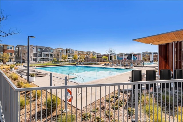 view of swimming pool with a patio