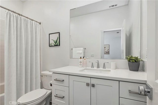 full bathroom with vanity, toilet, and shower / bath combo with shower curtain